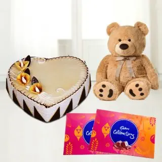 heartshape butterscotch cake with 2 box of celebration chocolates with 1 feet height teddybear 