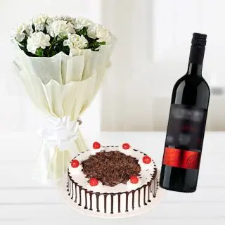 Bunch of 15 white carnations with vanilla cake with bottle of red wine