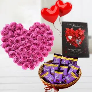 30 pink roes heart shape arrangement, basket of dairy milk chocolates, 2 heart shape balloons, with valentine greeting card 