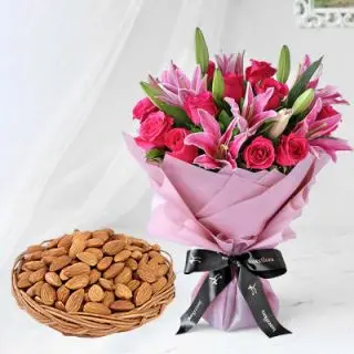 Bunch of pink lilies & pink roses with basket of half kg almonds 