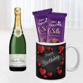 Bottle of champagne, photo mug with 2 dairy milk silk 