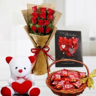 Beautiful bunch of 12 red roses in jute packing, basket of kit kat chocolates, greeting card, with 6 inch teddy bear 