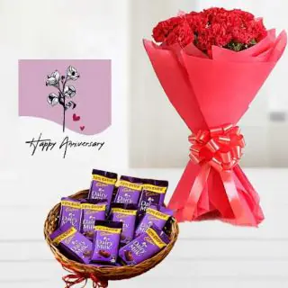 Bunch of 20 red carnations ,  Basket of 10 dairy milk chocolates, anniversary greeting card 