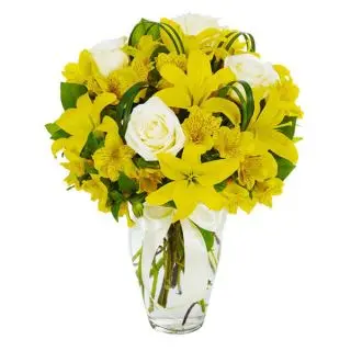 6 Yellow lilies with10 white roses beautifully arranged in Vase