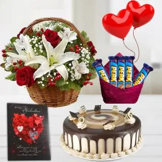 Basket of red roses with asiatic white lilies, half kg irish coffee cake, pack of 5 perk chocolates, 2 heart shape balloons with greeting card 