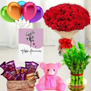 Bunch of 50 red roses, Basket of 7 dairymilk silk, 2 Fivestar, 6 inch height teddybear , 2 layer Lucky bamboo plant ,5 blown balloons with anniversary greeting card