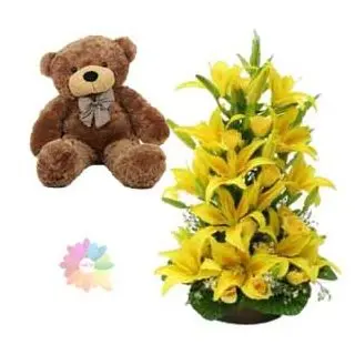 Exclusive arrangement of yellow  lilies and roses with 2 feet height brown colour teddybear