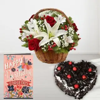 Basket arrangement of red and white lilies , heart shape black forest cake, birthday  greeting card 