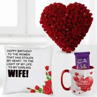 Heart shape arrangement of 50 red roses , photo mug with 2 dairy milk silk with photo cushion 