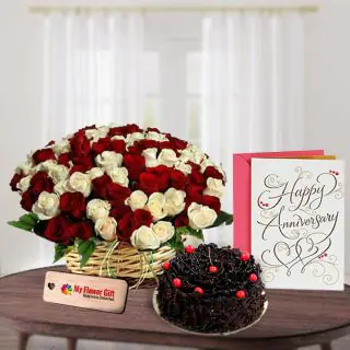 50 red and white roses basket arrangement with 1 kg chocolate fantasy cake with anniversary card 