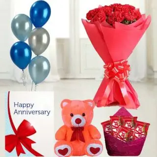Bunch of 15 red carnations, 6 inch height teddy bear, set of  5 kitkat chocolates, anniversary greeting card with 5 blown balloons 