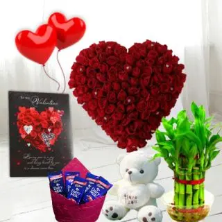 Basket arrangement of 20 red roses, 3 bournville chocolates, 6 inch height teddybear, 2 layer Lucky bamboo plant, 5 blown balloons with greeting card