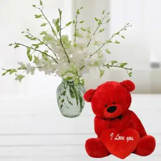 Vase arrangement of 10 white orchids with a cute 6 inch teddy bear 