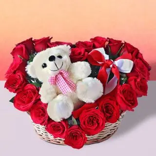 heart shape arrangement with teddy bear