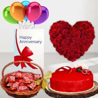 Heart shape arrangement of 40 red roses, basket of 20 kitkat chocolates, red velvet cool cake, anniversary Greeting card, with 5 blown balloons