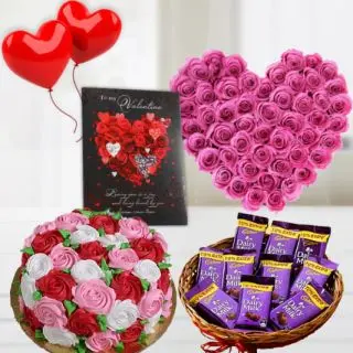 40 pink roses heart shape arrangement , half kg floral theme cake, basket of dairy milk chocolates, greeting card ,2 heart shape balloons 