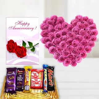 Heart shape arrangement of 30 pink roses, basket of assorted chocolates , anniversary Greeting card