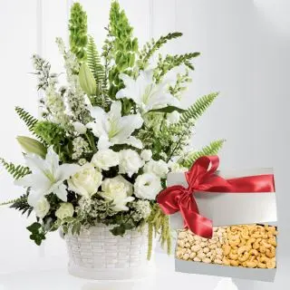 Basket of white exotic flowers with assorted cashew&pistachio
