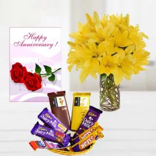 Vase arrangement of 5 yellow lilies, basket of assorted chocolates, anniversary Greeting card