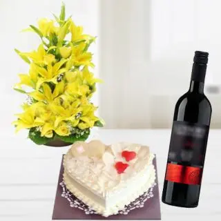 exotic arrangement of asiatic lilies with 2 feet height with vanilla heart shape cake with bottle of red wine