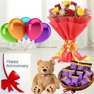 Bunch of 12 mix roses,  6 inch teddybear, Basket of  dairy milk chocolates, anniversary  greeting card with 5 blown balloons 