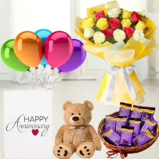Bunch of 15 mix roses, 6 inch teddybear, Basket of dairy milk chocolates, anniversary  greeting card with 5 mix blown balloons 