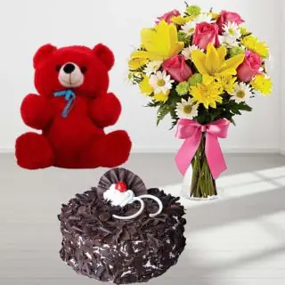 Beautiful vase arrangemnt of 15 mix flowers with premium quality black forest cake with 6 inch teddybear 
