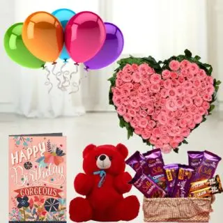 Heart shape arrangement of 100 pink roses, 6 inch teddybear, Basket of 7  dairy milk silk chocolates with 2  Fivestar, birthday greeting card with 5 blown balloons