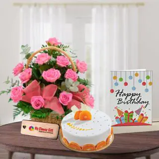 Basket Arrangement of 10 pink roses with half kg orange cake with birthday card 