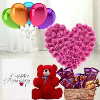 Heart shape arrangement of 50 pink roses, 6 inch teddybear, Basket of 7  dairy milk silk chocolates with 2  Fivestar, anniversary greeting card with 5 mix blown balloons