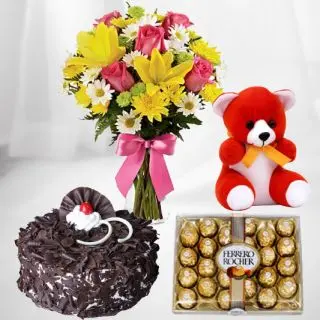 12 mixed flowers  in glass vase with box of 24 pc ferero rocher chocolates with 6 inch height teddybear and  blackforest cake