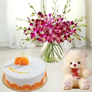 Exotic vase arrangement of 10 lavender orchids with 6 inch teddybear with orange cool cake 