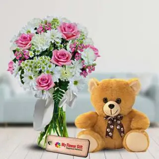 Mix exotic flowers beautifully arranged in glass vase with 1 feet height teddy bear 