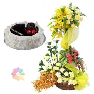 4 feet height arrangement of Exotic mix flowers with 1 kg choco vanilla cake 