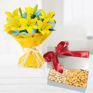 Bunch of 8 yellow asiatic lilies  with basket of half kg cashew and almonds