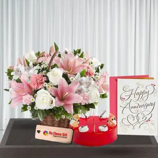Exotic basket Arrangement of 15 mix flowers with Half kg red velvet cake with anniversary card 