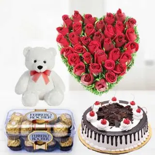 30 Red Rose heart shape arrangement with 16 pcs ferrero rocher chocolateswith 6 inch teddy,1 pound Black Forest cake