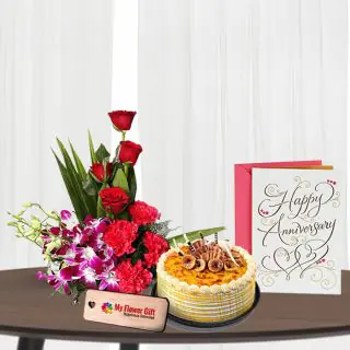 Basket Arrangement of roses carnations with orchids , half kg honey cake with anniversary card