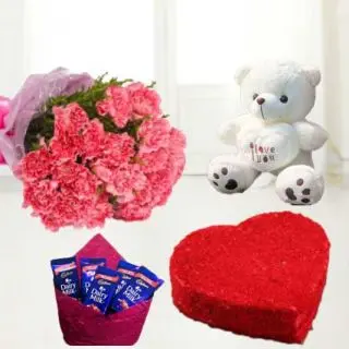 Bunch of 10 pink carnations with 6 inch cream colour teddy bear with heart shape red velvet cake with set of 5 dairy milk chocolates