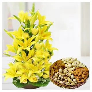 Exclusive lilies arrangement with 2 feet height with box of assorted dryfruits