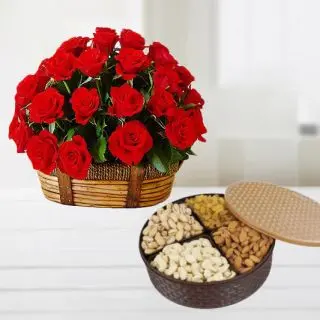 Basket arrangement of 50 red roses with basket of assorted dryfruits