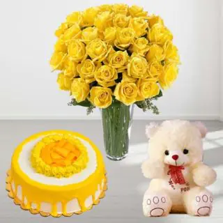 Vase arrangement of 30 yellow roses with premium quality mango cake with 1 feet height teddybear 