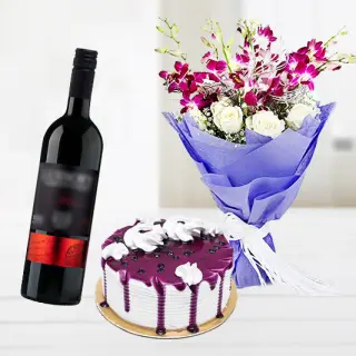 Bouquet of lavender orchids with white roses with bottle of wine with blueberry fresh cream red cake