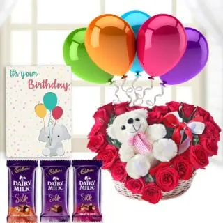 6 inch teddybear sitting in heart shape arrangement , 3 dairy milk silk chocolates, birthday Greeting card with 5 blown balloons 