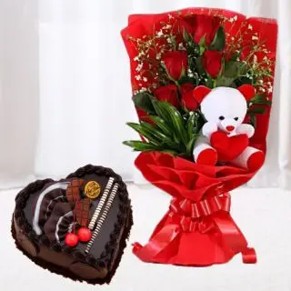 6 red roses bunch with 6 inch teddybear arranged in it along with 1 kg heart shape chocolate cake