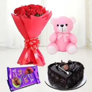Bunch of 10 red carnations with 1 feet height pink teddy bear, heart shape chocolate truffle cake with pair of dairy milk silk chocolates