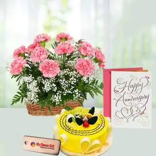 Basket of 12 pink carnations, half kg pineapple cake, anniversary card 