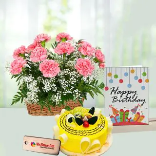 Basket of 12 pink carnations, half kg pineapple cake, birthday card 