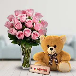 12 pink roses in glass vase with 1 feet height teddy bear 