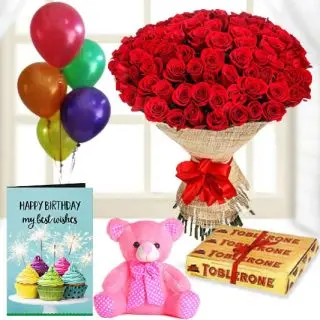 Beautiful Bunch of 100 red roses, 6 inch pink teddybear, 3 toblerone chocolates, birthday Greeting card with 5 blown balloons 
